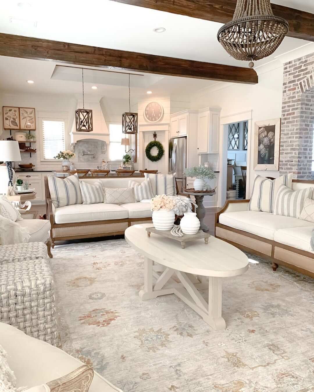 Oval Coffee Table With X-Base Creates a Light and Airy Centerpiece
