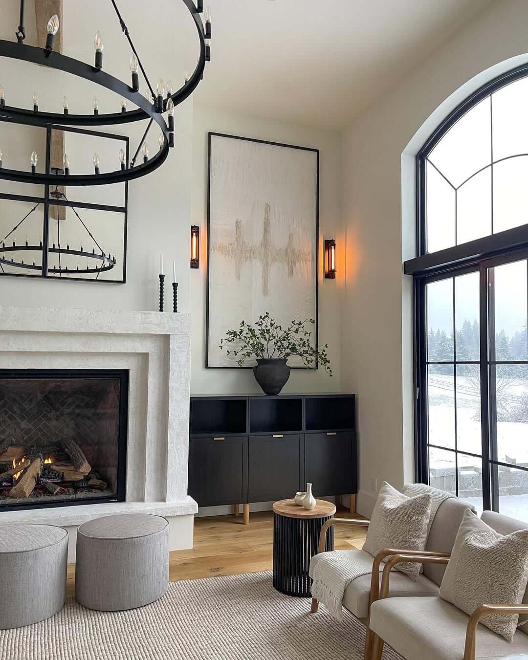 Oversized Vertical Artwork Anchors a Minimalist Black Cabinet