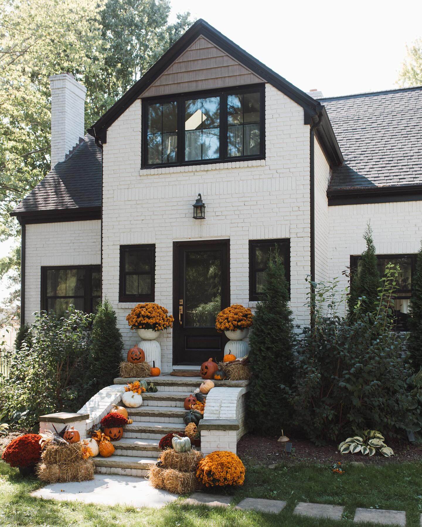 Hay Bales and Mums Create Layered Visual Interest on Steps