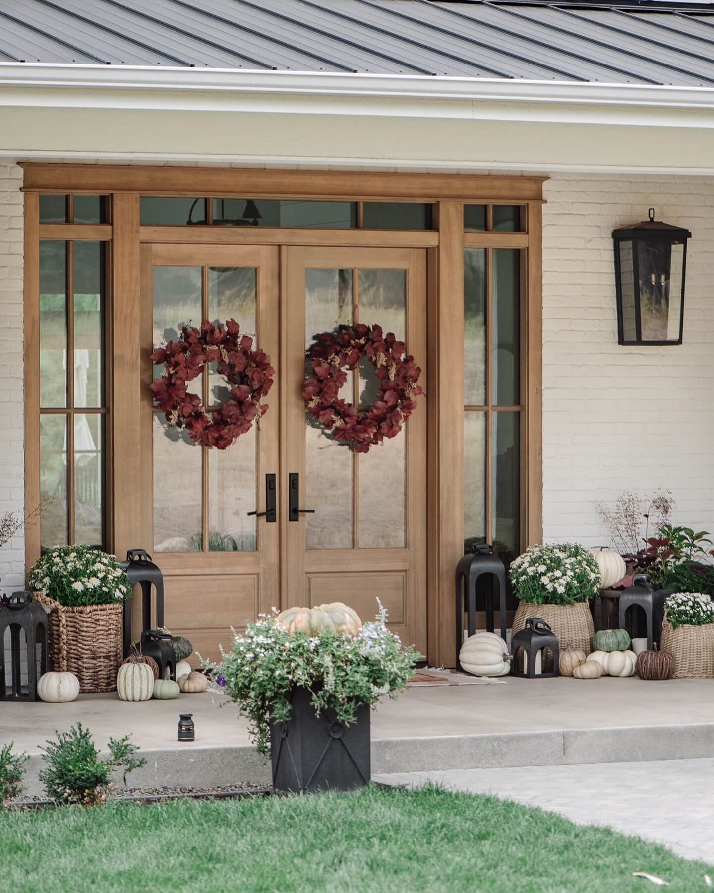 Double Door Wreaths Welcome Guests with Deep Burgundy Hues
