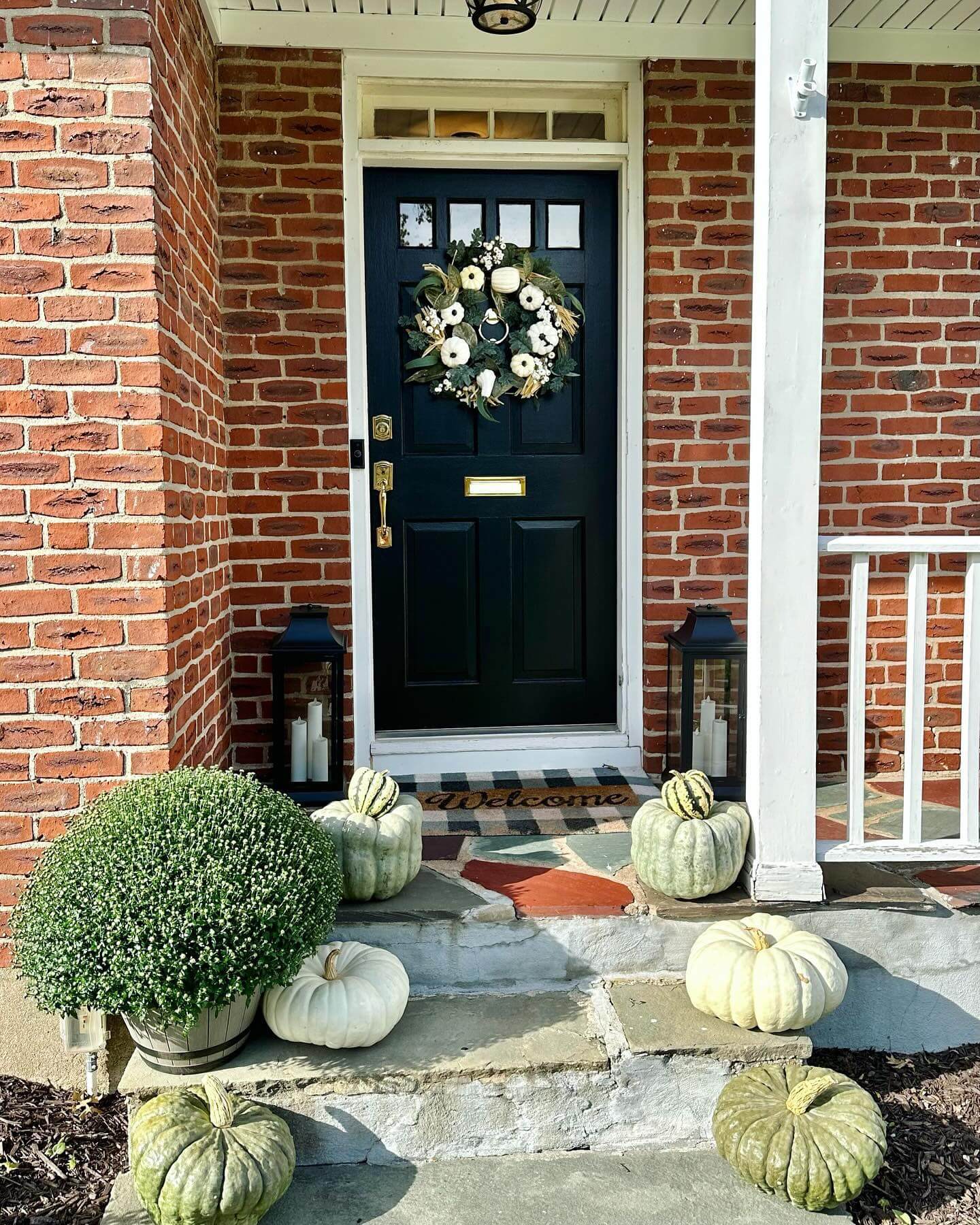 Tall Black Lanterns Add Dramatic Height and Glow