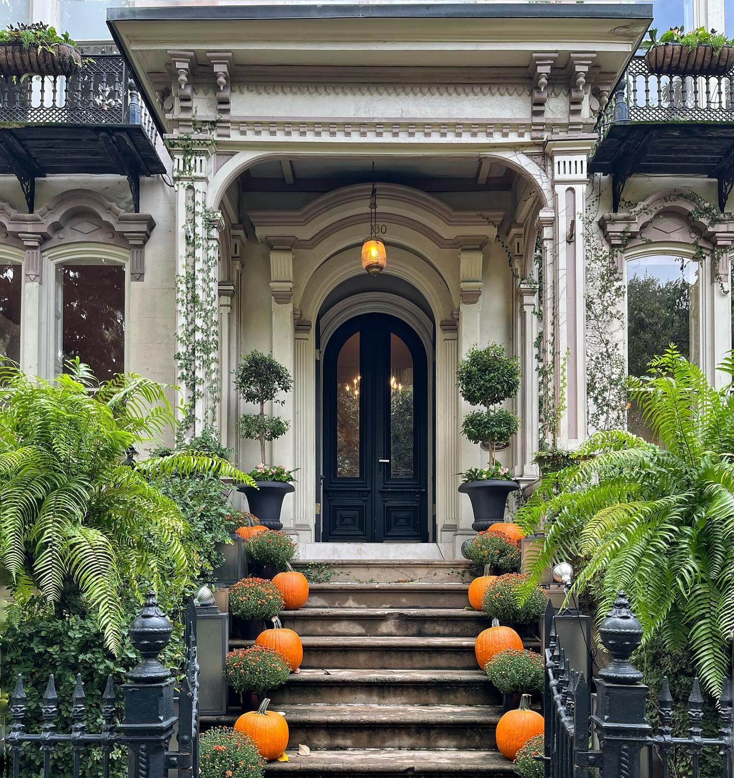 Tiered Pumpkin and Mum Display Guides Guests Up the Steps