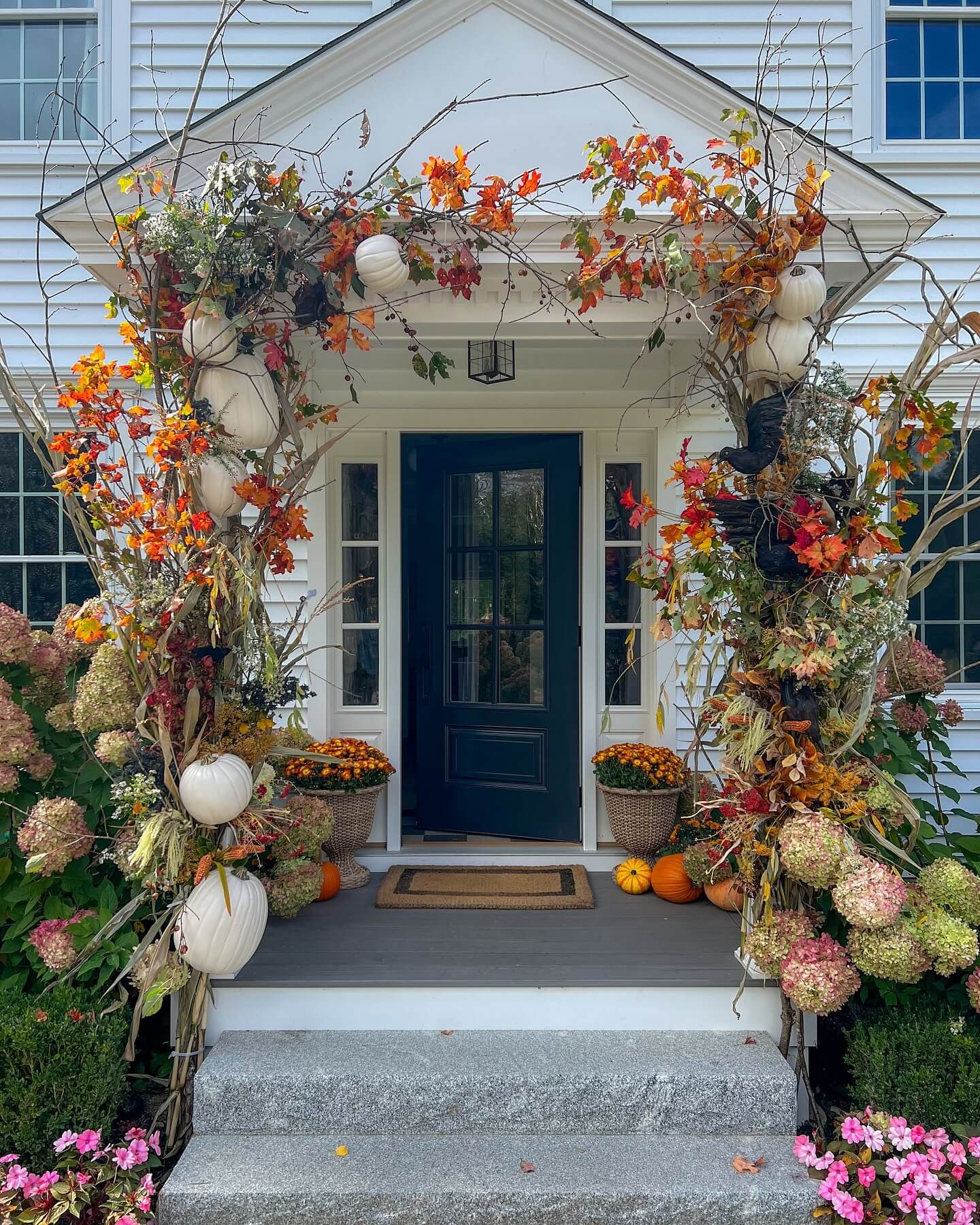 Dramatic Archway of Fall Foliage and White Pumpkins