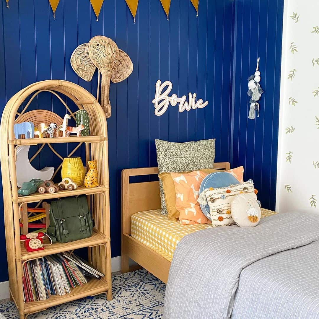Arched Rattan Bookshelf Displays Whimsical Safari-Themed Toys