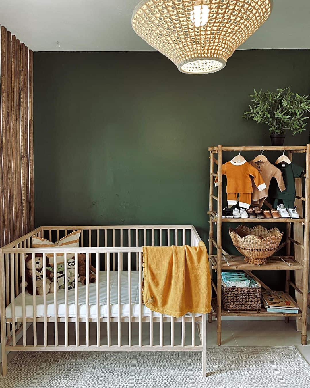 Bamboo Ladder Shelf Displays Baby Clothes and Woven Storage