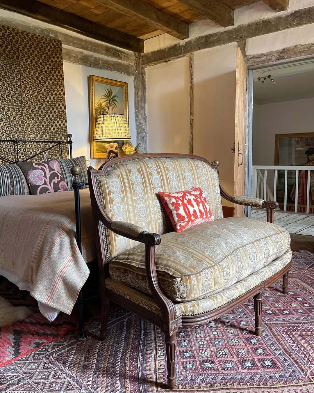 Petite Settee with Carved Frame and Patterned Upholstery