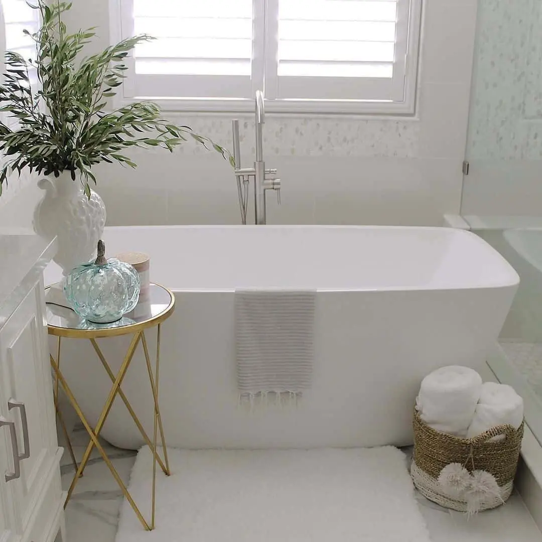 Place Bath Time Essentials on a Gold Side Table
