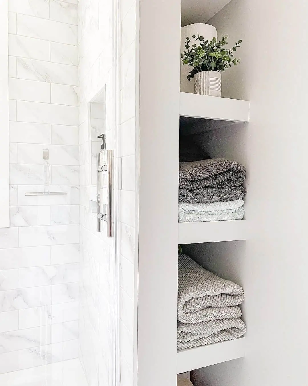 Stack Folded Towels on White Shelves