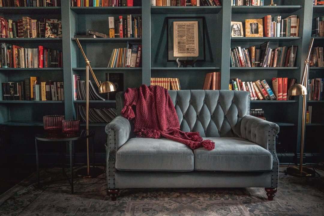 Anchor a Seating Nook with a Deep Teal Bookcase