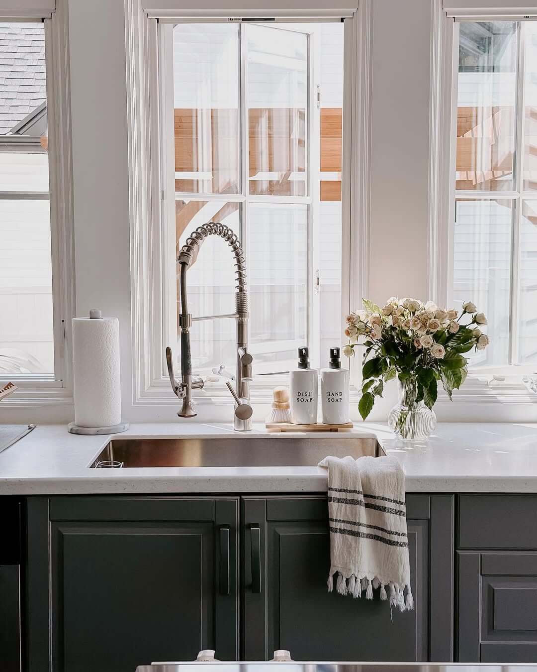 White Soap Dispensers and Brush on a Wooden Tray