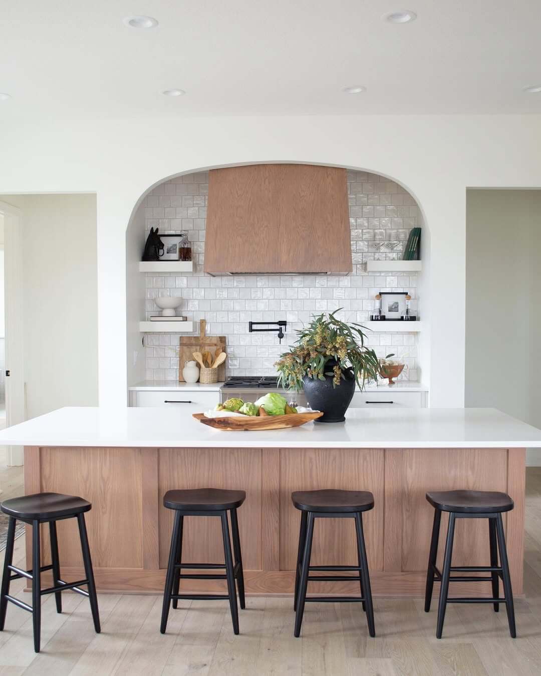 Arched Niche with White Subway Tile and Wood Vent Hood
