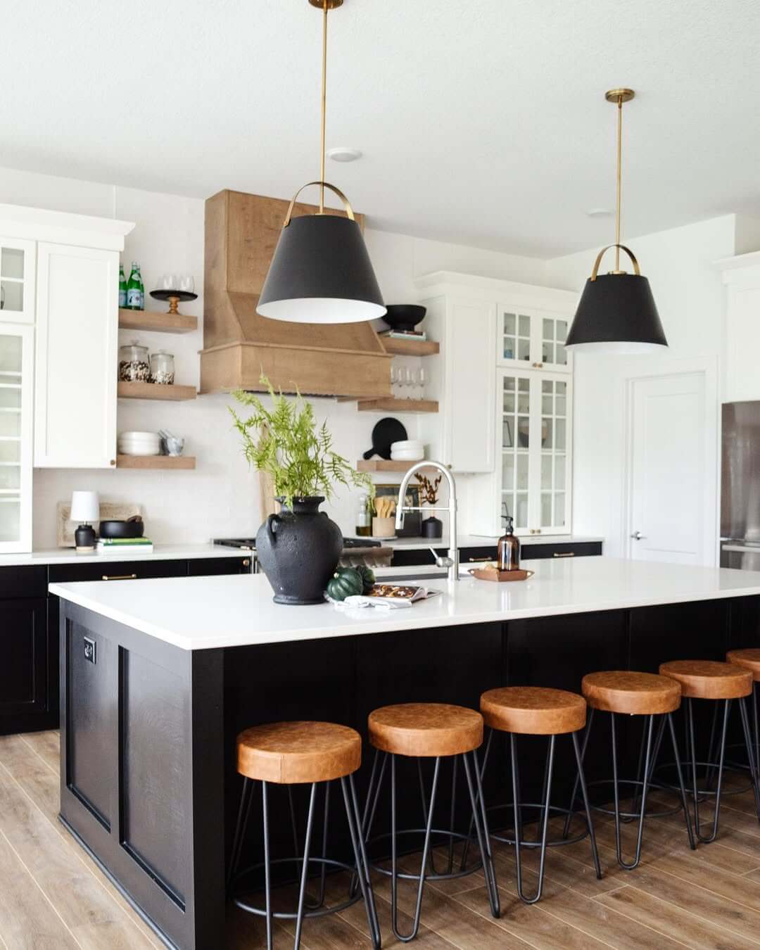 Black Island with Leather Stools Creates Casual Seating