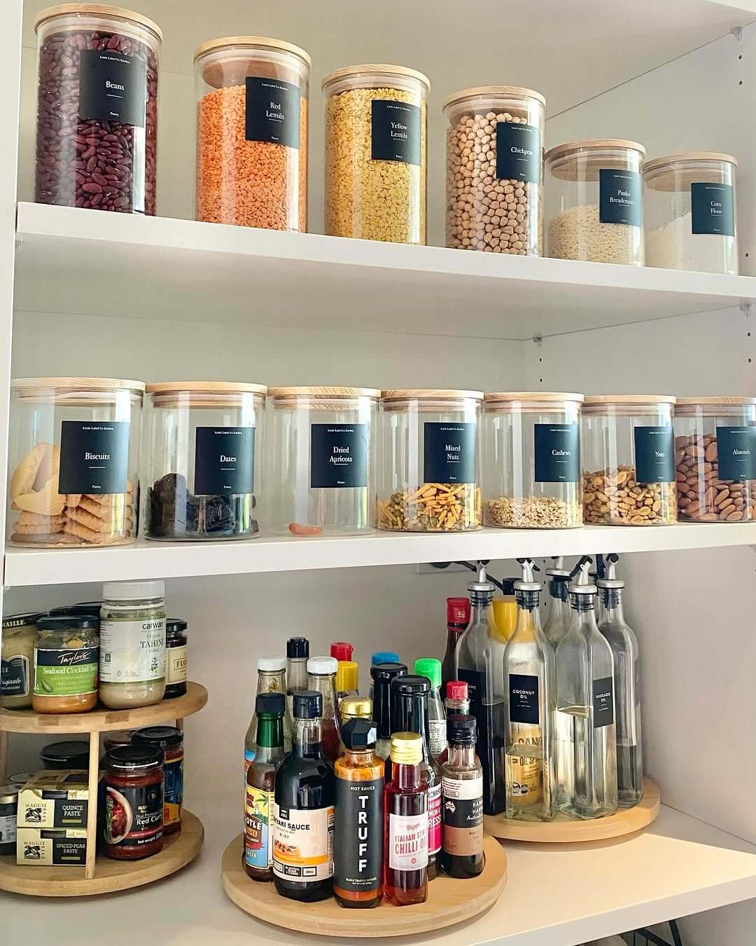 Glass Canisters with Natural Wood Lids Create a Uniform Look