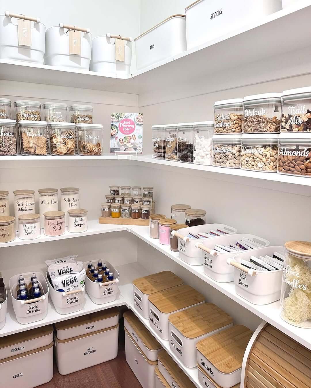 White Bins with Bamboo Lids Contain Snacks and Baking Supplies