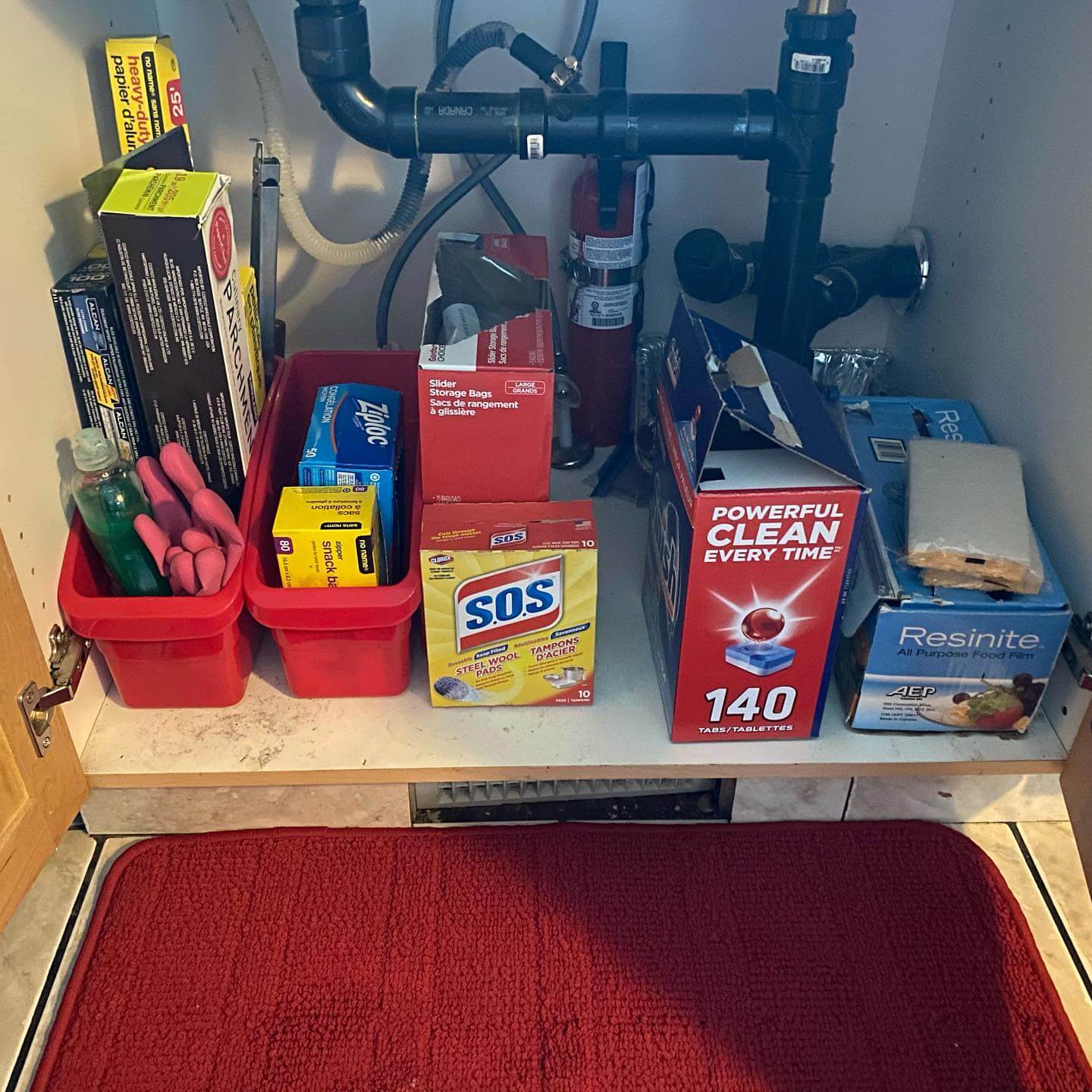 Corral Kitchen Essentials and Cleaning Supplies in Red Bins