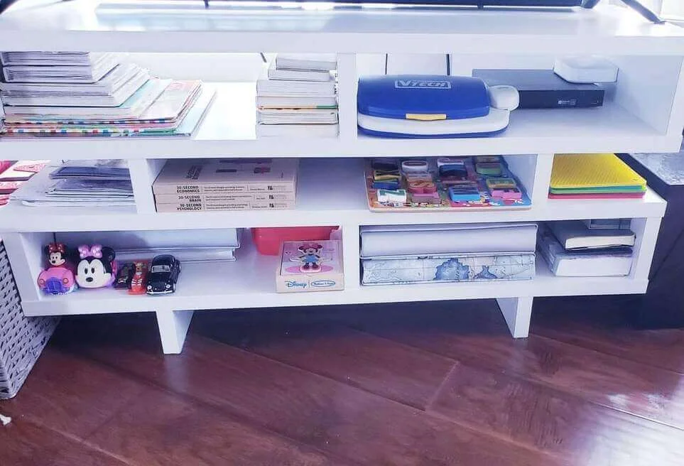 Open Shelving Unit Organizes Books and Small Toys