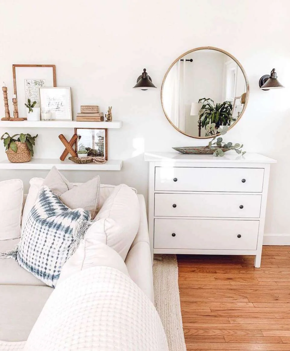 Floating Shelves Display Artwork Above a Sofa