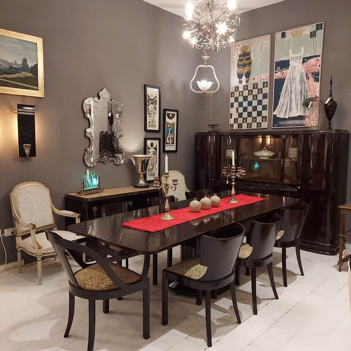 Ornate Mirror Reflects Glamour Above a Dark Credenza
