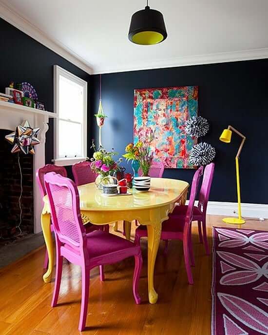 Juxtaposed Art and Bold Furniture Create a Vibrant Dining Space