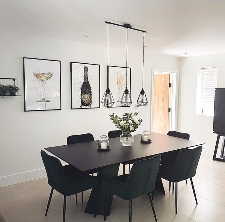 Champagne Art Adds Festive Flair Above a Sleek Dining Table