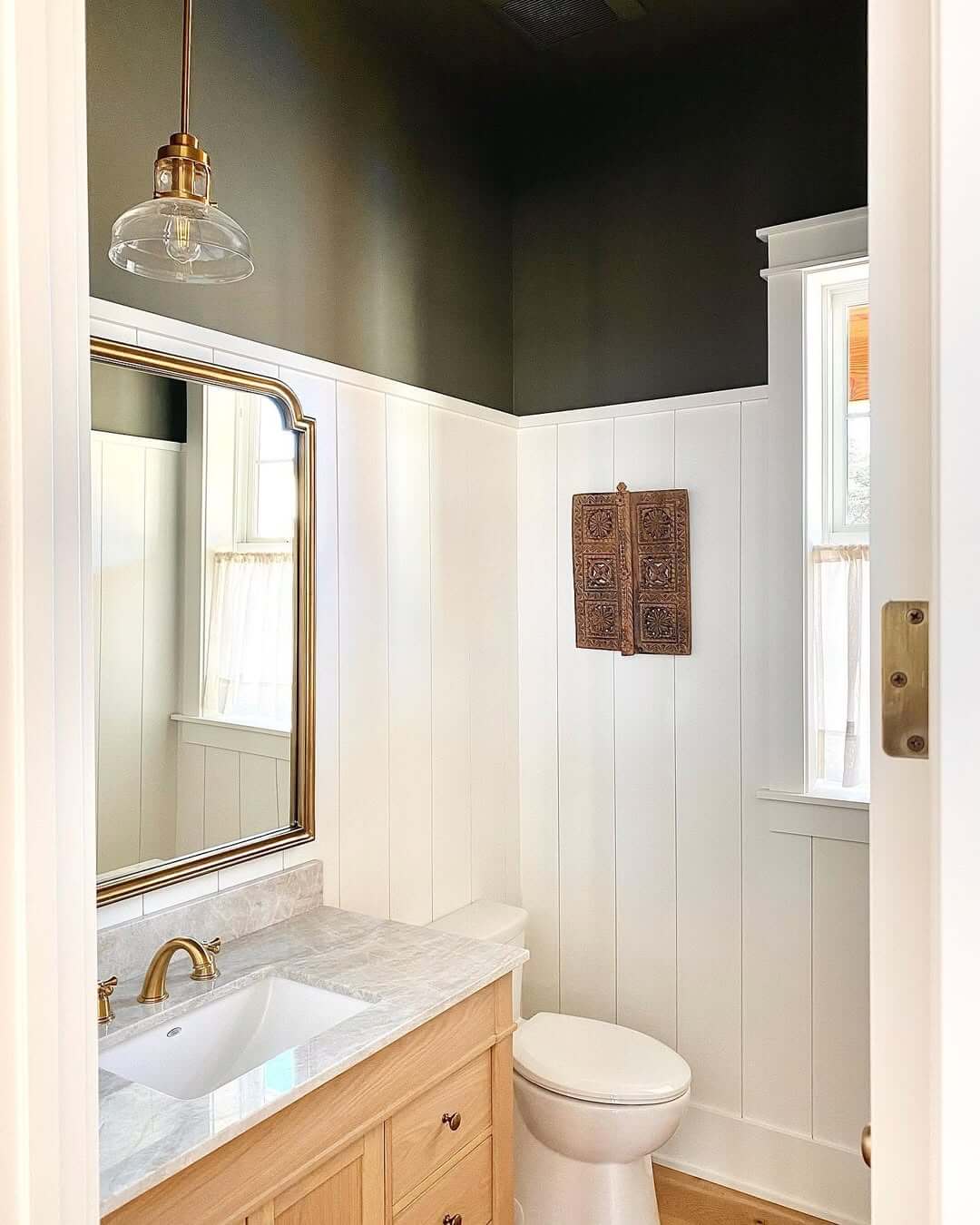 Carved Wooden Panel as a Bathroom Accent