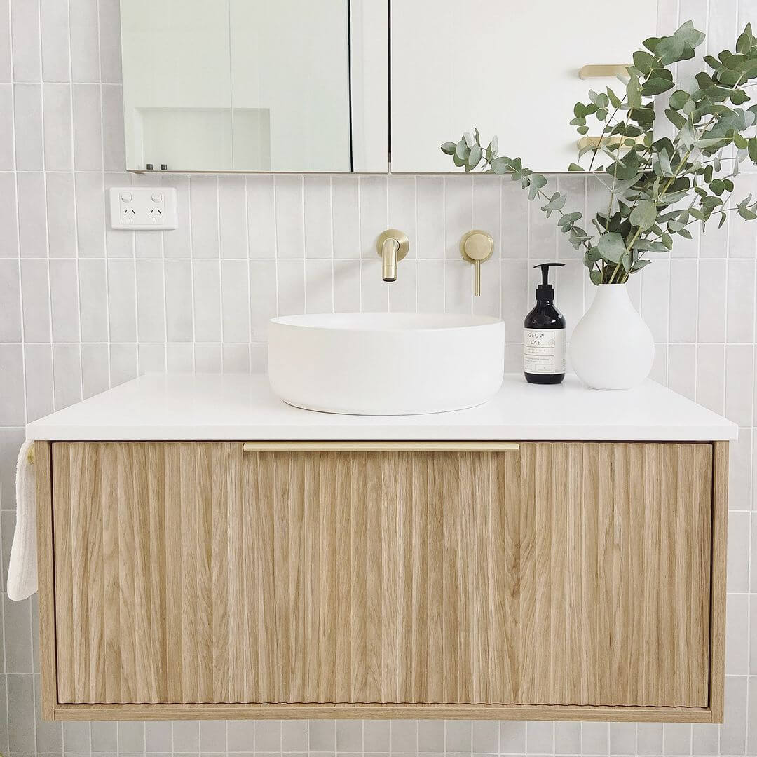 Fluted Wood Vanity Adds Natural Texture to Light Bath