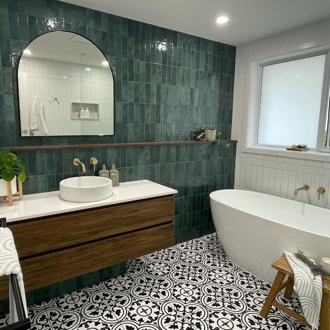 Deep Emerald Vertical Tile Walls Create a Jewel-Box Bathroom