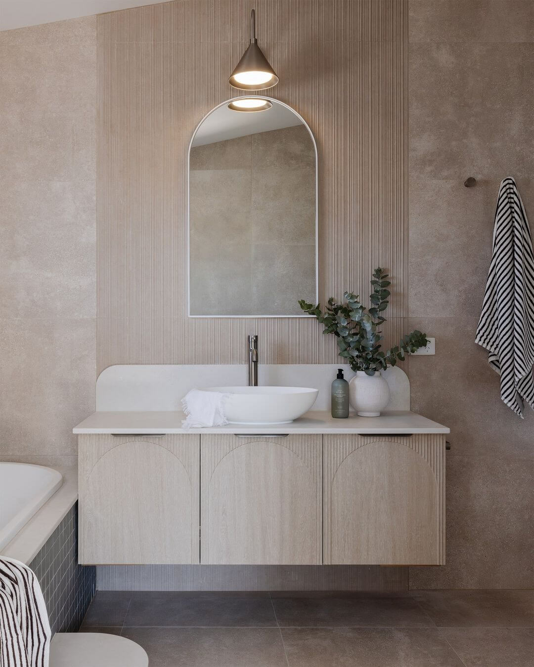 Curved Arch Cabinet Doors Add Softness to Wood Vanity