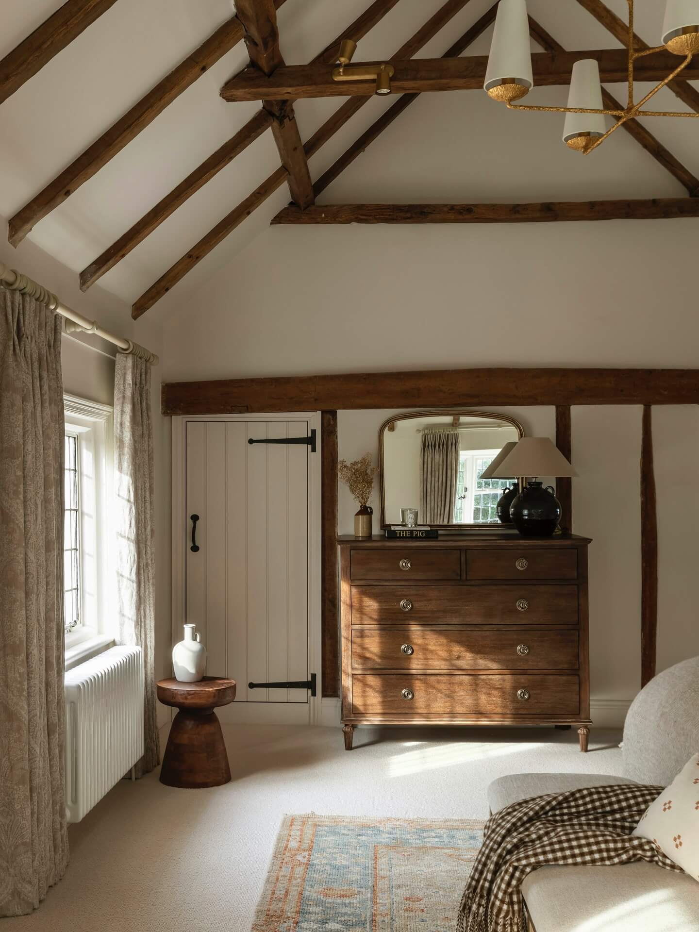 Exposed Beams Define Sloping Ceilings in Rustic Bedrooms
