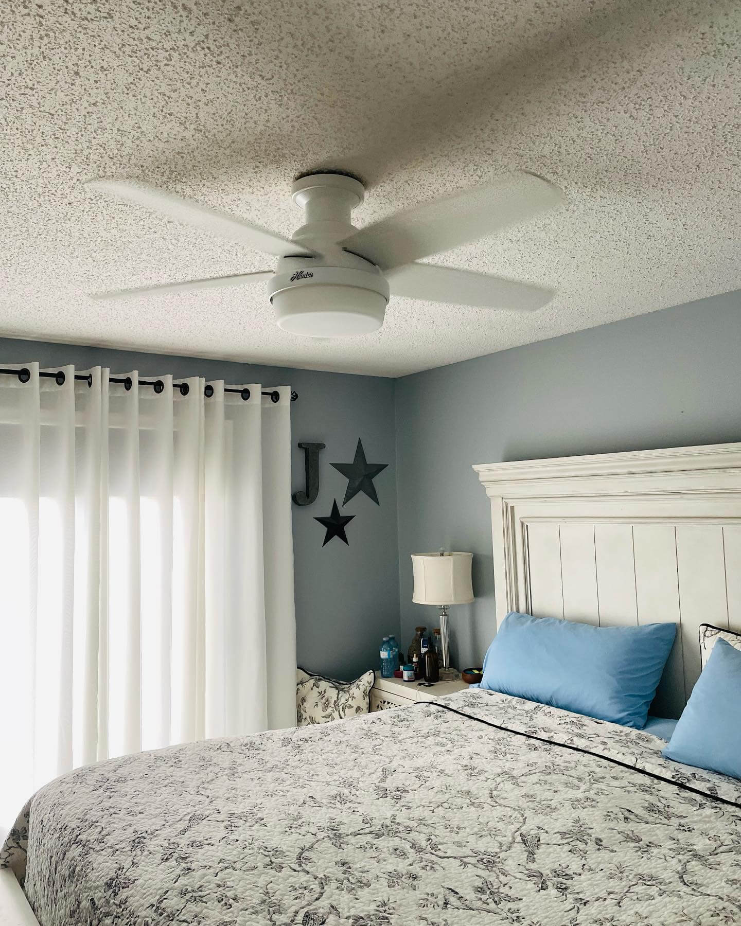 White Ceiling Fan Adds Airflow to High Ceilings