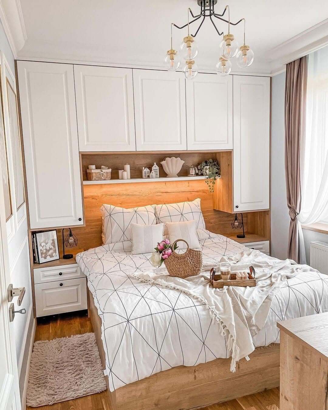 Built-in headboard shelving displays decorative accents