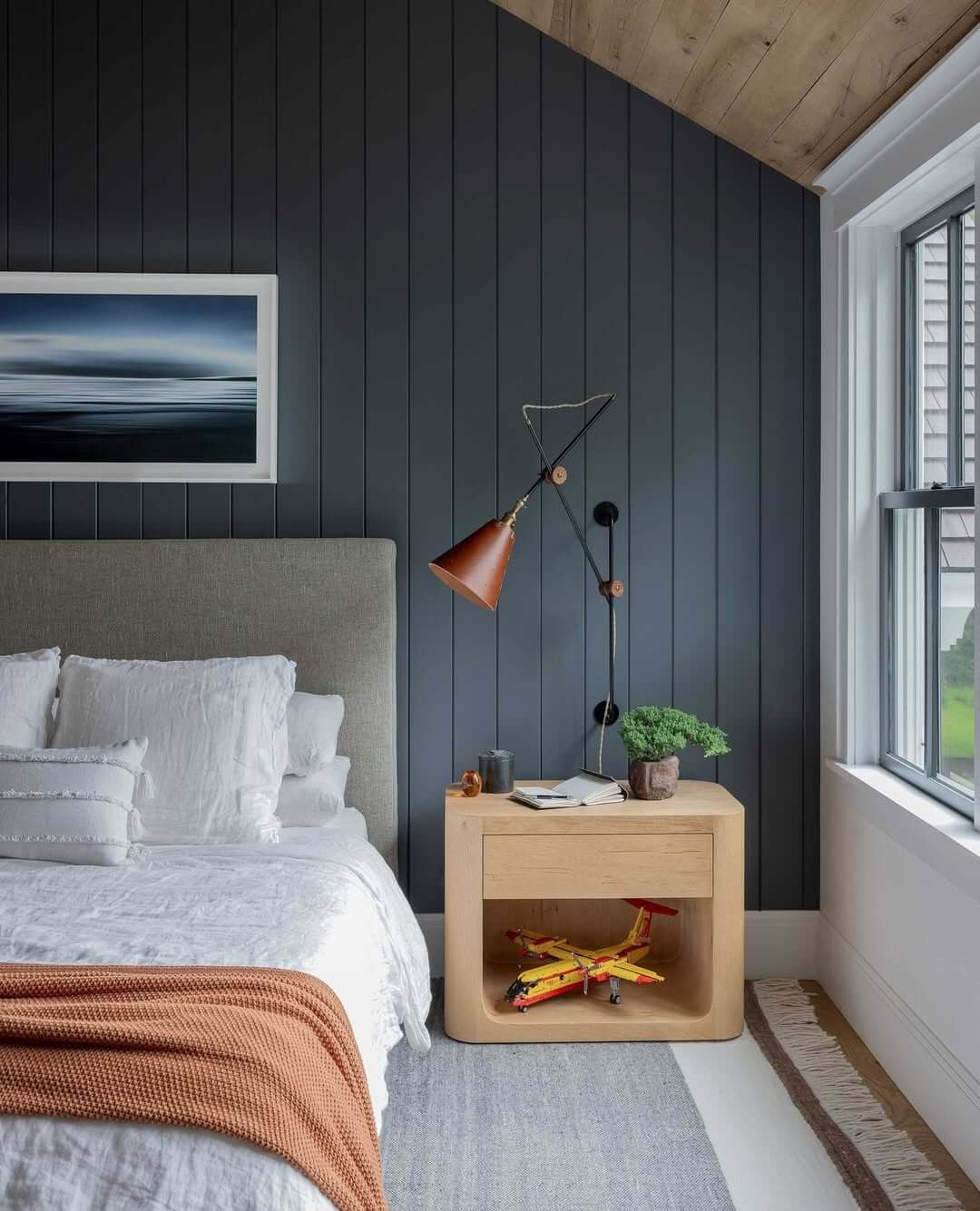 Vertical Plank Wall Adds Subtle Architectural Detail Above Bed