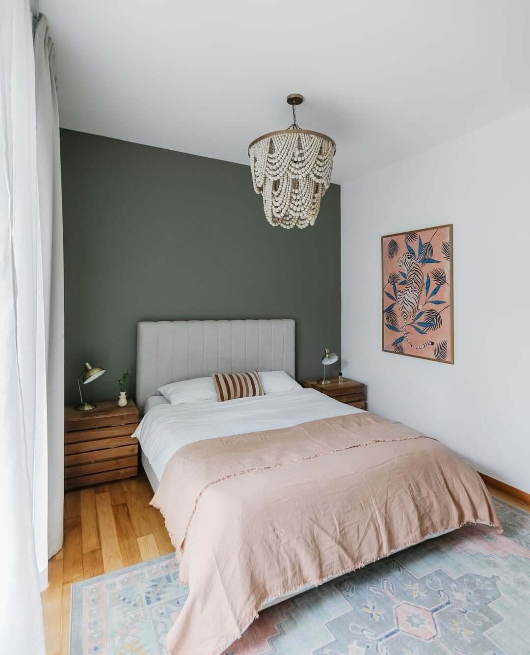 Dark Green Accent Wall Creates Moody Depth Behind Bed