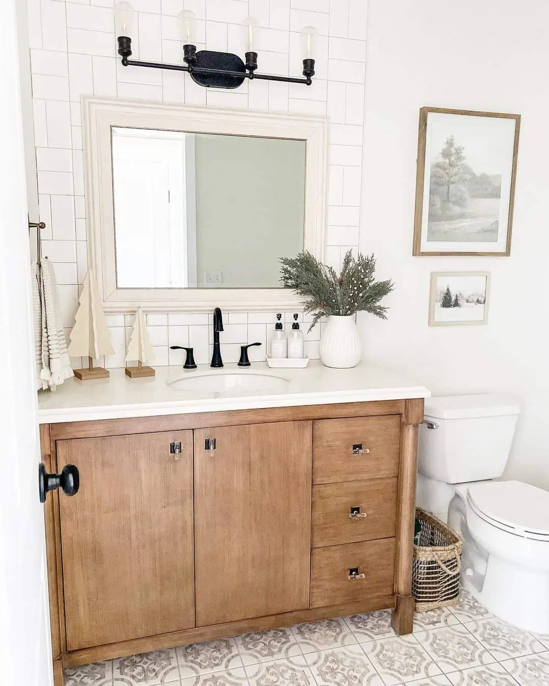 Layered Landscape Art Above the Toilet Adds Depth