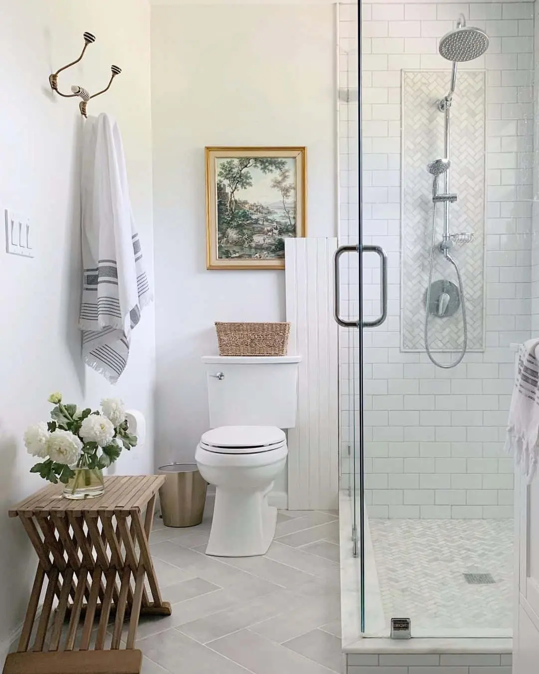 Framed Pastoral Scene Adds Old-World Charm Above the Toilet