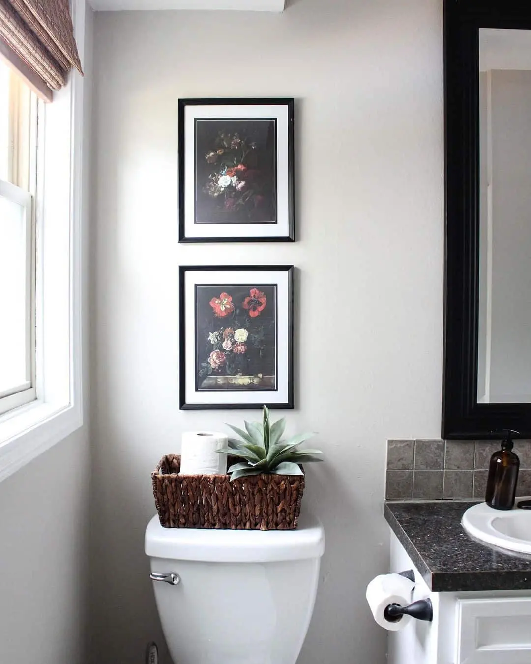 Two Dark Floral Prints Add Vintage Charm Above the Toilet