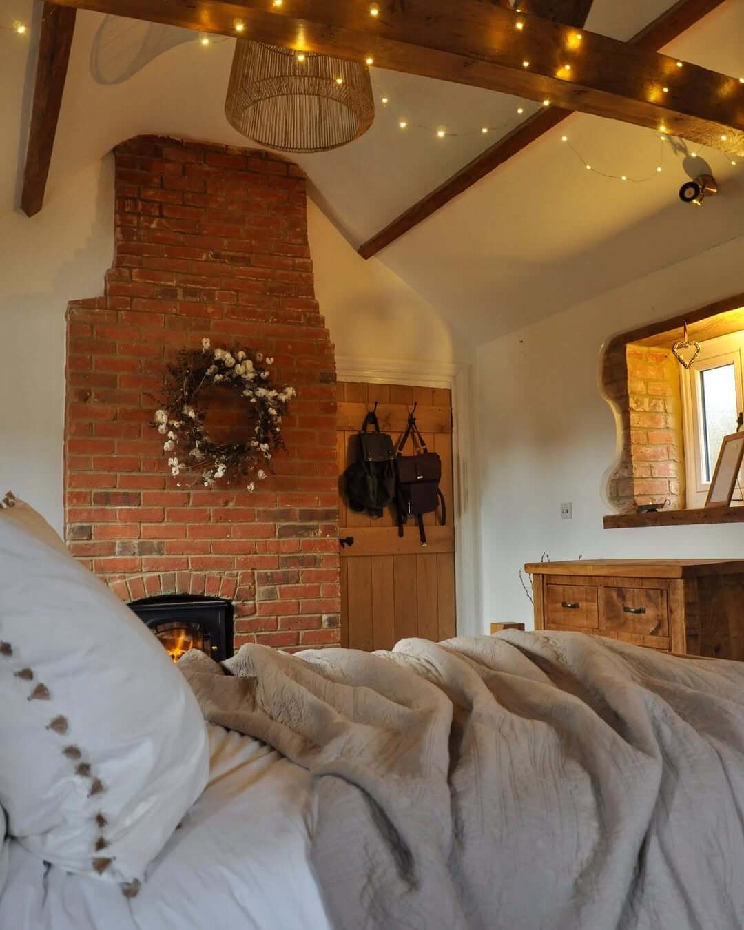 Rustic Brick Fireplace with Cotton Wreath and String Lights