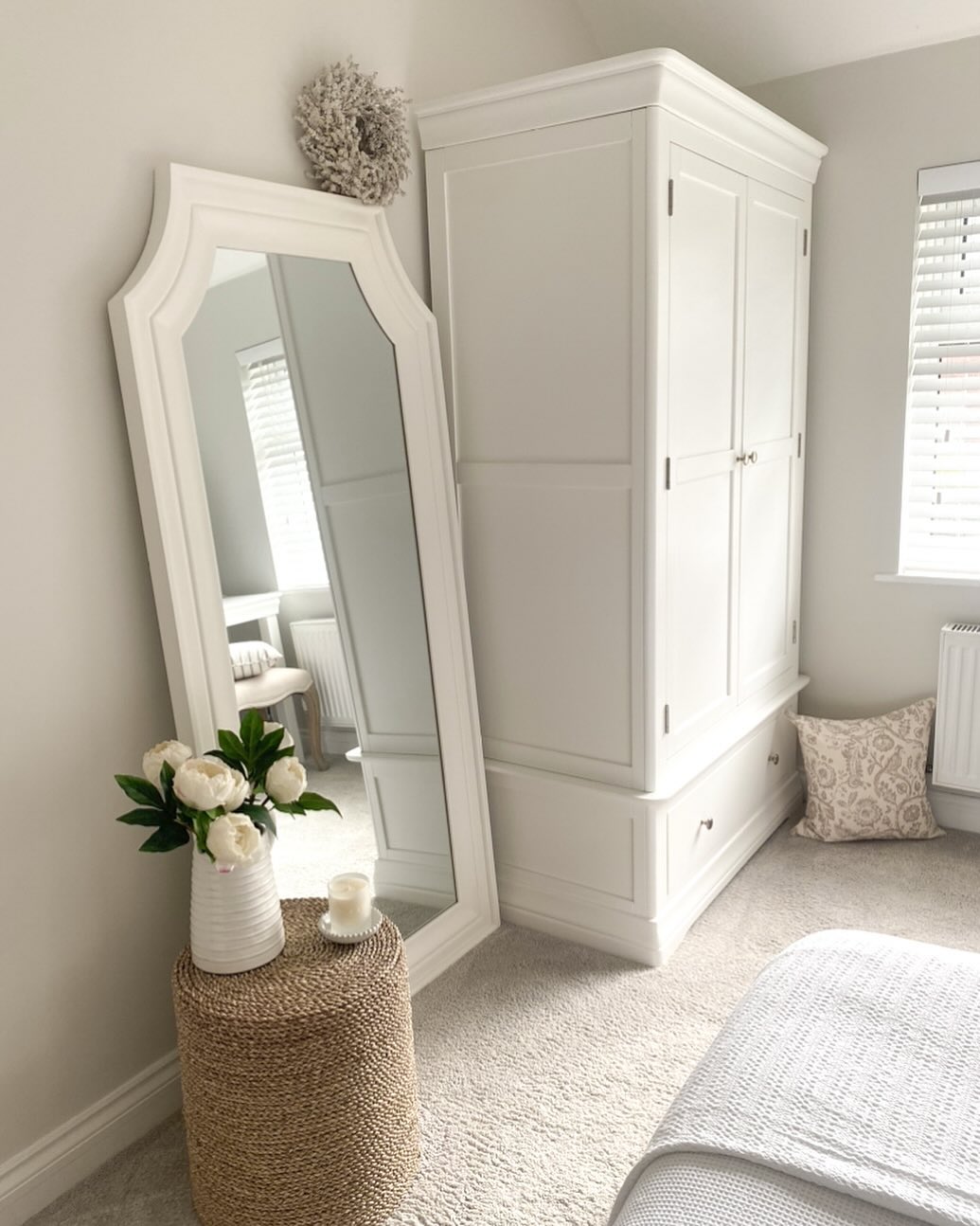 Tall Arched Mirror Adds a Feminine Touch Beside Wardrobe
