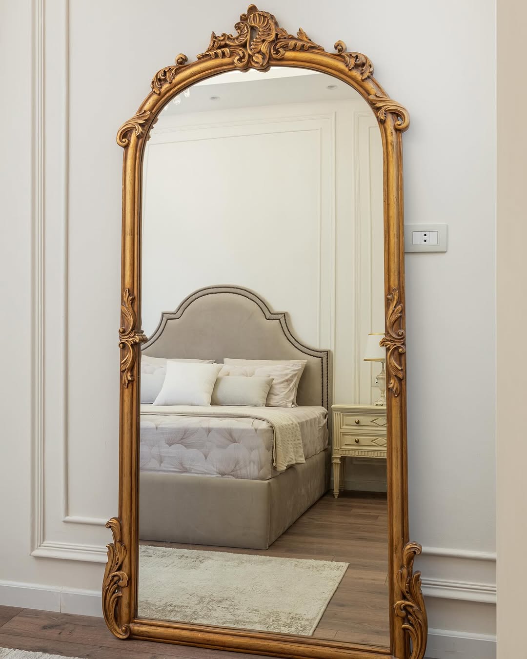 Reflect a Softly Styled Bedroom with an Ornate Gold Arched Mirror