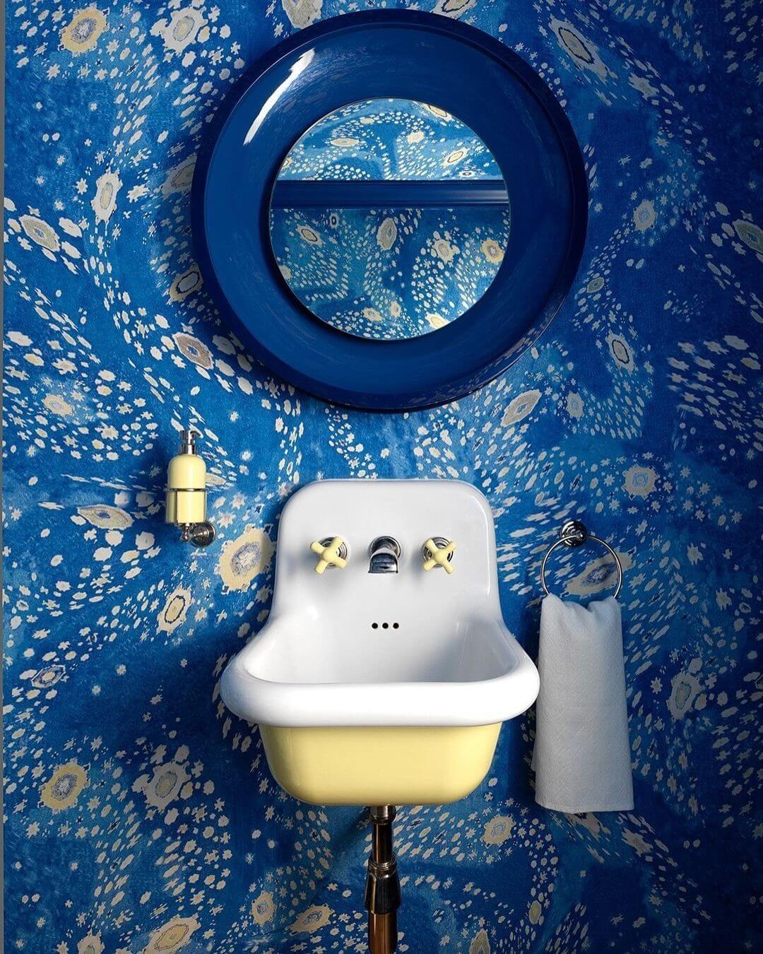 Playful Powder Room with Blue Floral Wallpaper and Yellow Accents