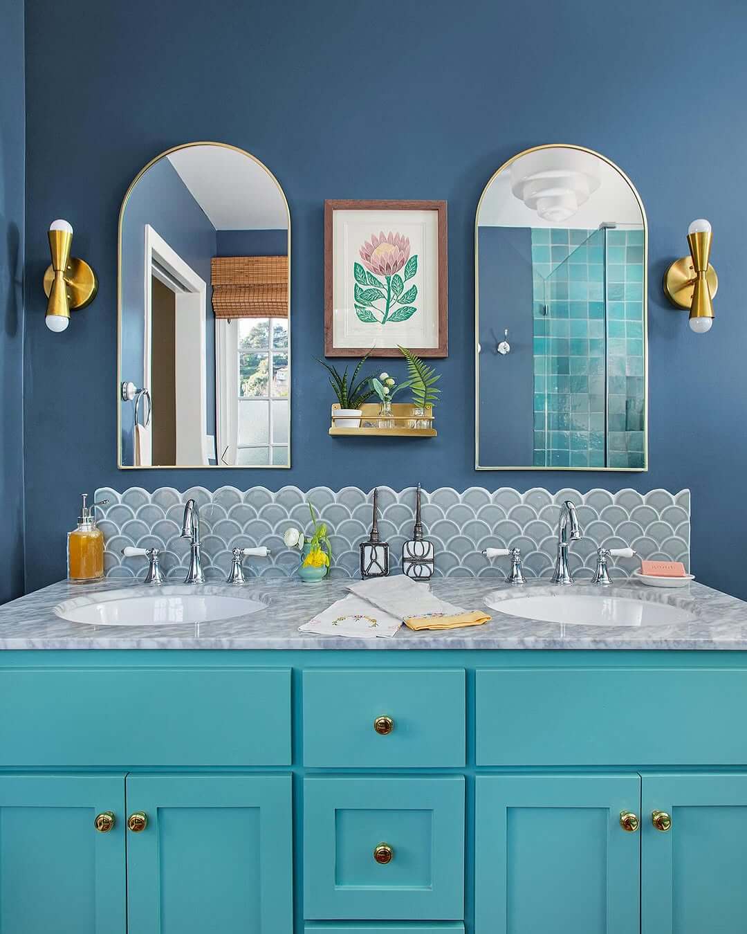 Turquoise Vanity Cabinets Anchor a Marble Countertop