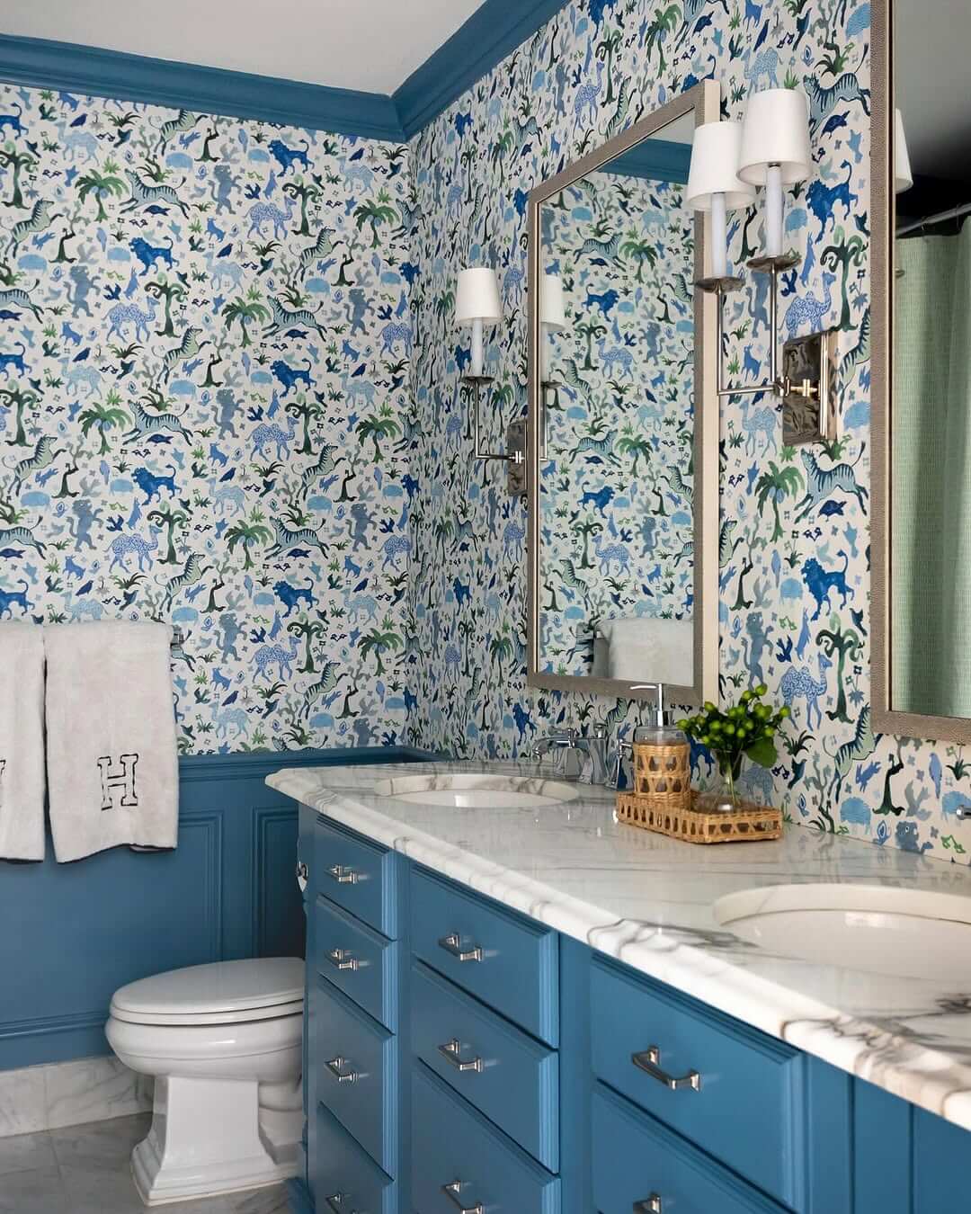 Whimsical Animal Wallpaper Adds Playful Charm Above Blue Vanity