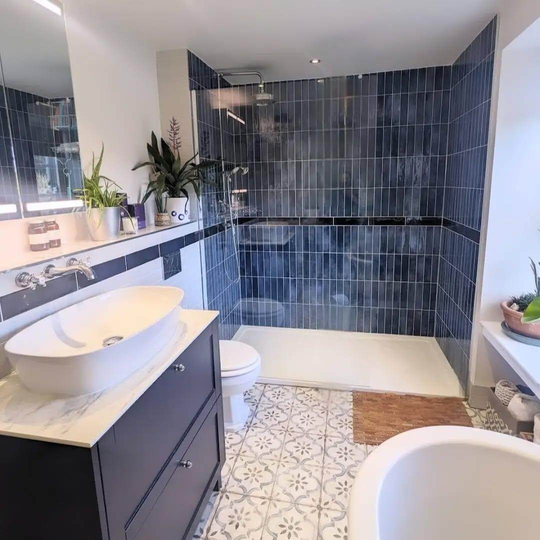 Dark Blue Vanity Pairs with Patterned Floor for Bold Contrast