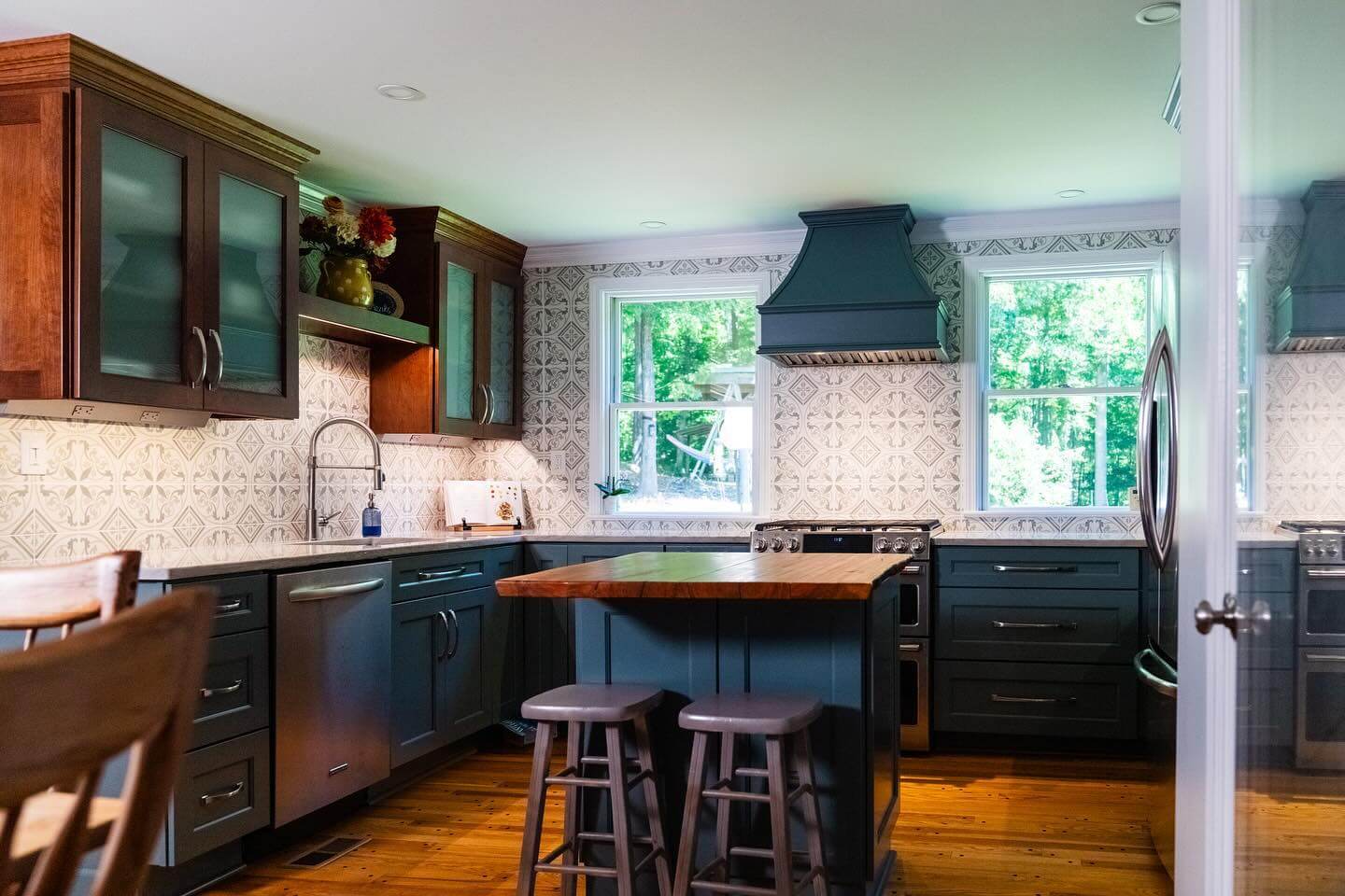 Deep Teal Range Hood With Geometric Backsplash