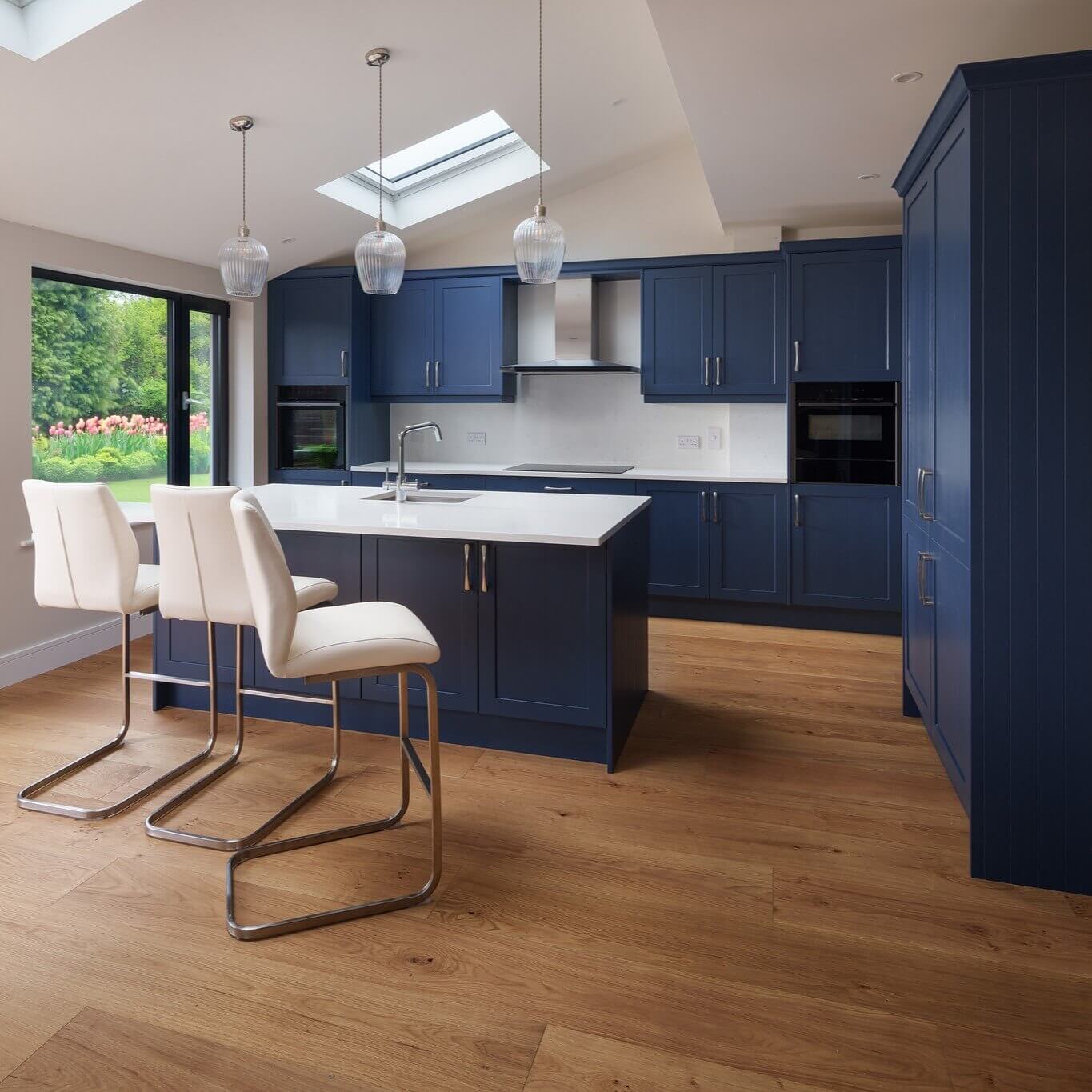 Brighten Your Space with Deep Blue Cabinets and White Countertops