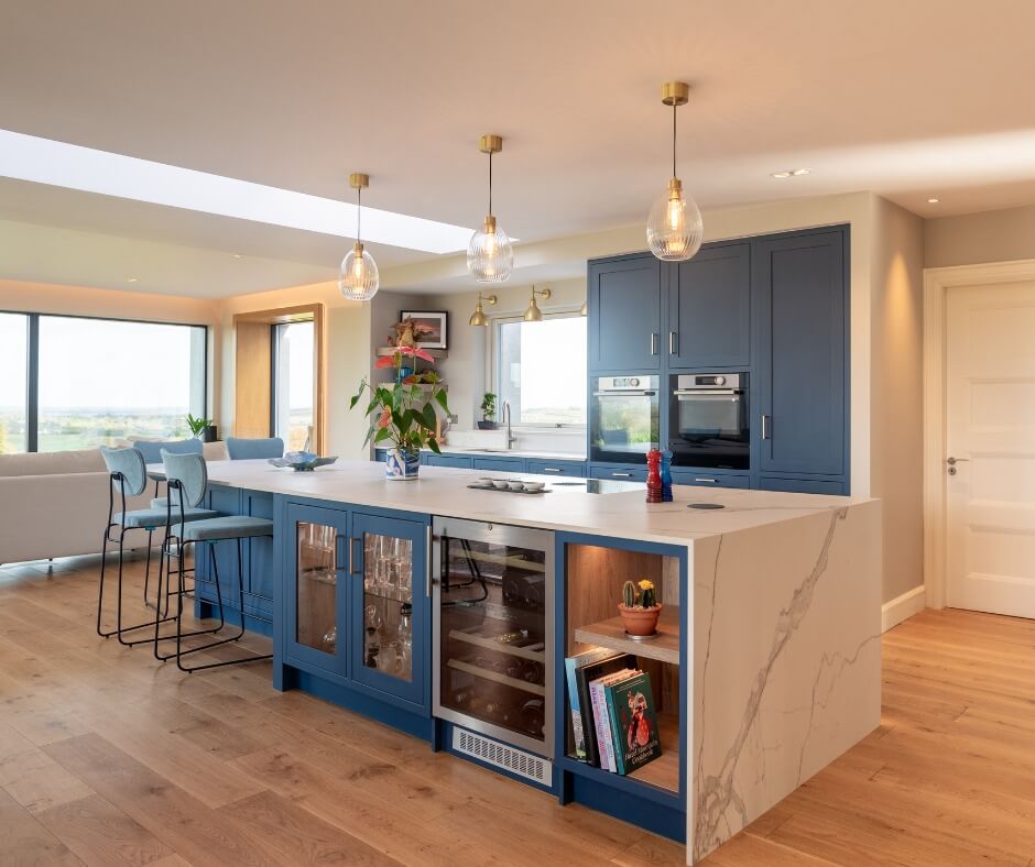 Blue island cabinets house glass-fronted wine and glass storage