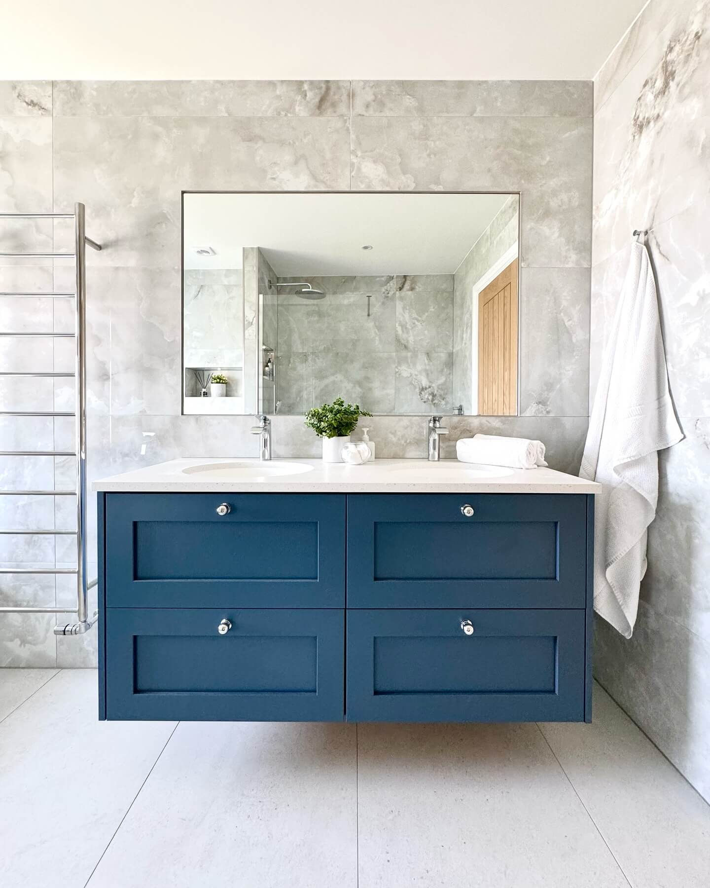 Deep Blue Floating Vanity With Simple Silver Knobs