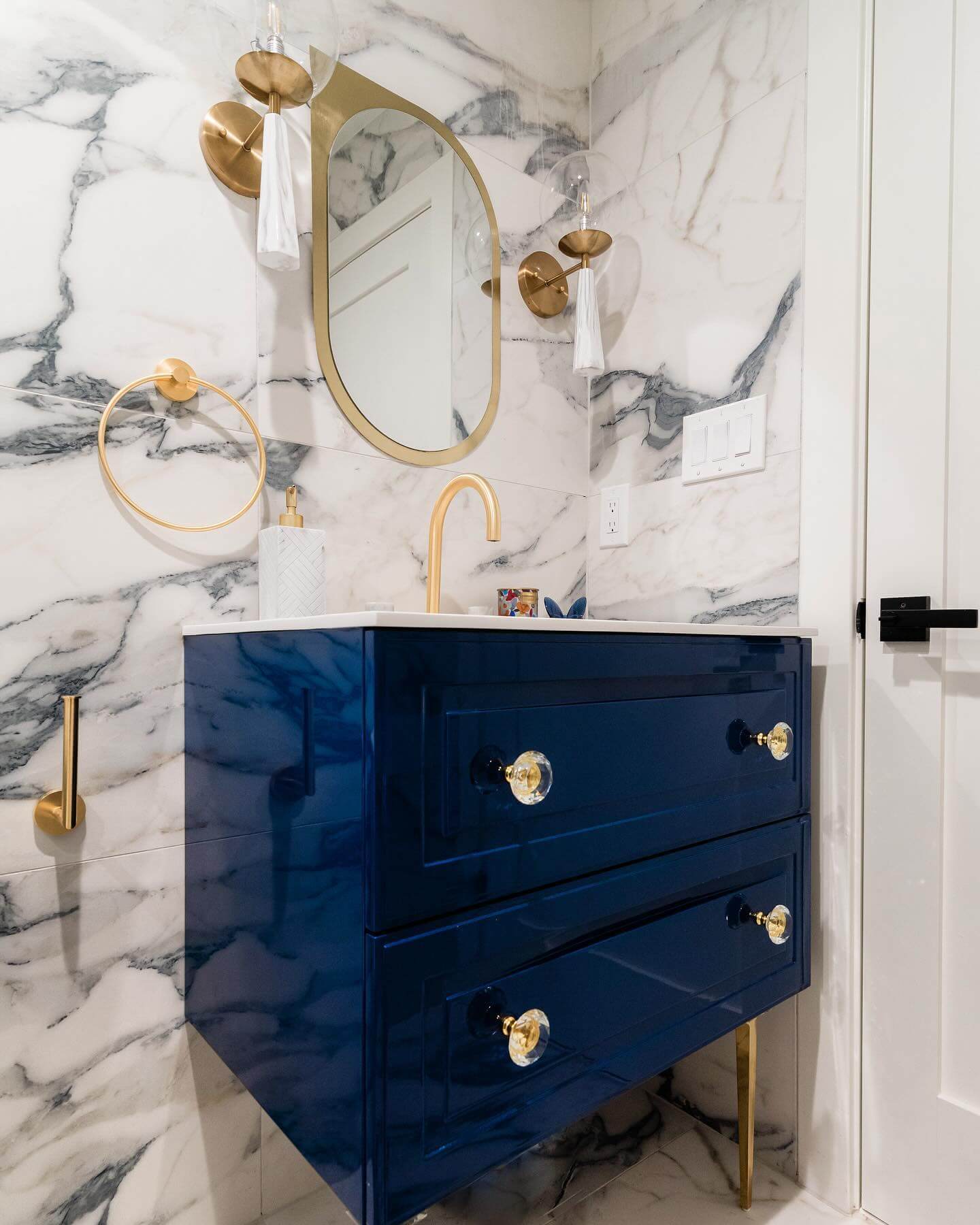 Crystal Knobs Add Glamour to Deep Blue Vanity Drawers