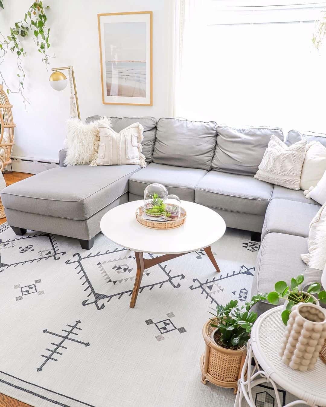 Round Tray Displays Terrariums and Greenery on White Coffee Table