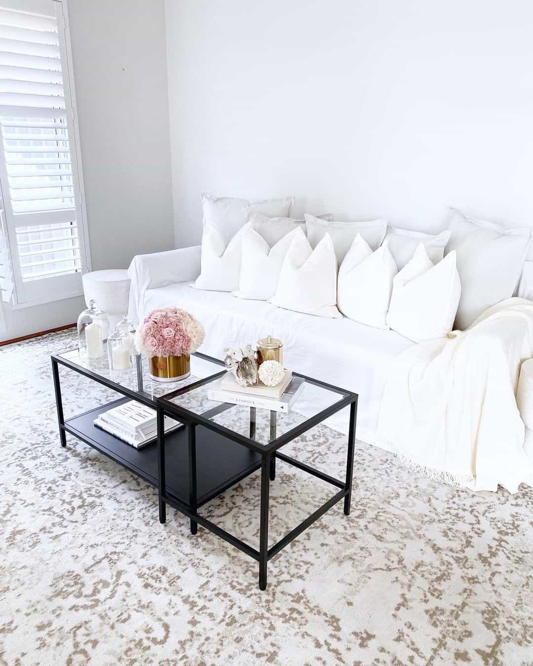 Layered Black and Glass Coffee Tables Create a Dynamic Duo
